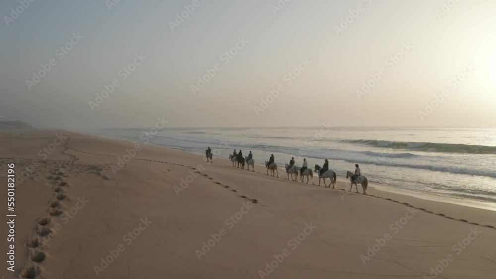 Horseback Riding Adventure In Praia de Melides Scenic Ocean In Portugal. Aerial Drone Shot Horseback Riding Adventure In Praia de Melides Scenic Ocean In Portugal. Aerial Drone Shot