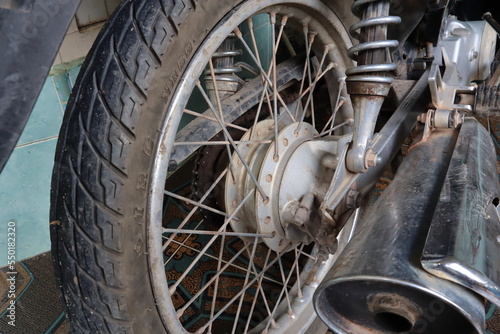 Motorcycle brake disc on a wheel. Close up of Single disc brake of a motorcycle