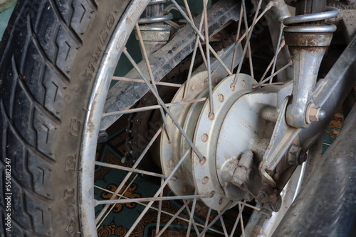 Motorcycle brake disc on a wheel. Close up of Single disc brake of a motorcycle