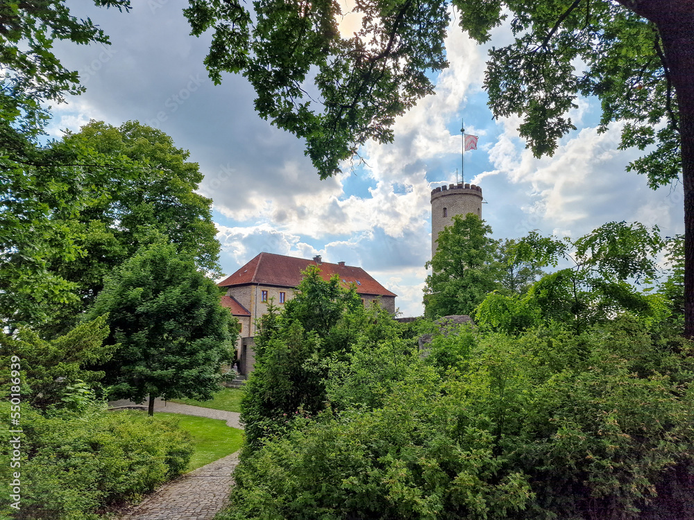 Sparrenburg Bielefeld with tower and walls under a nice cloudy blue sky