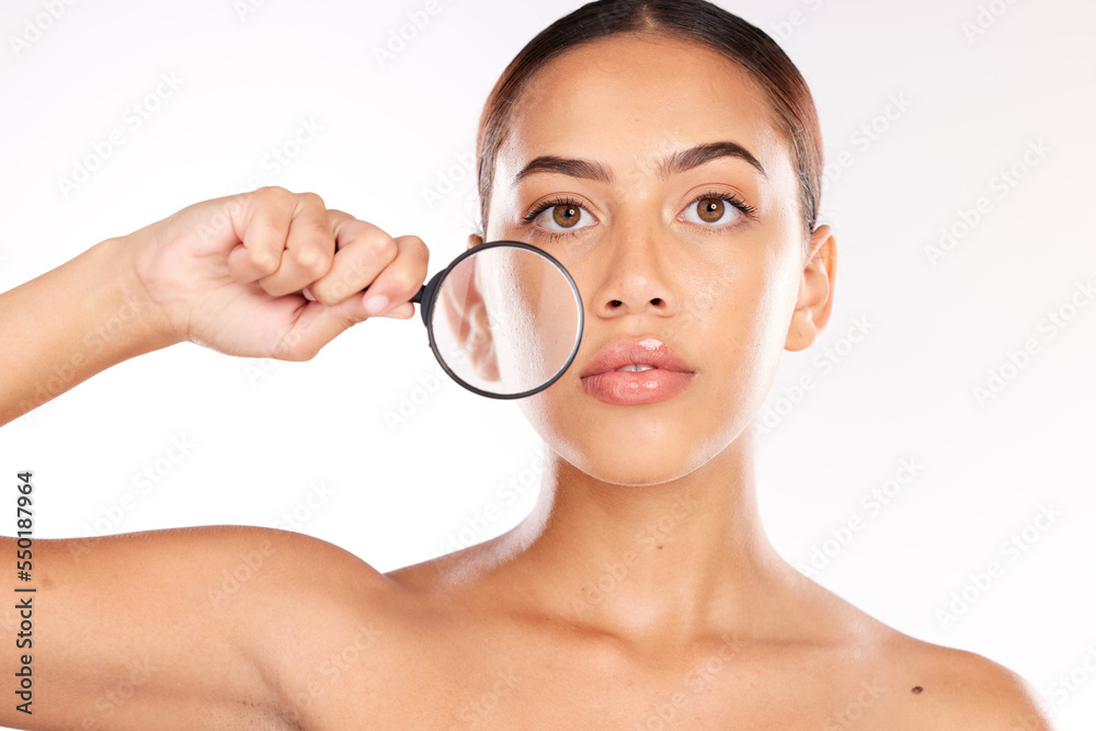 Woman, magnifying glass and skincare portrait for beauty wellness or healthy facial care in studio. Model face, Luxury spa cleaning and cosmetics makeup, check skin glow and natural dermatology Woman, magnifying glass and skincare portrait for beauty wellness or healthy facial care in studio. Model face, Luxury spa cleaning and cosmetics makeup, check skin glow and natural dermatology