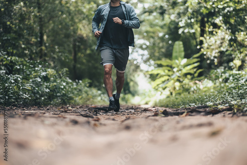 healthy lifestyle young fitness man running the forest. Outdoor workout, Healthy lifestyle concept.