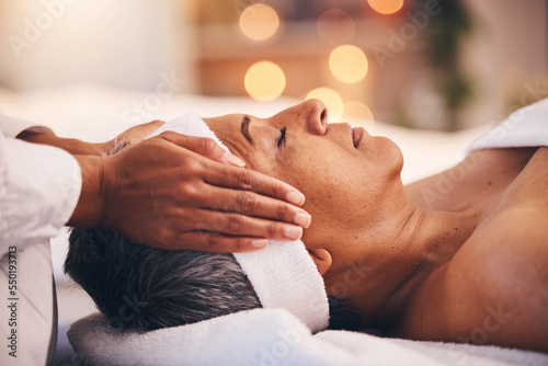 Wellness, health and massage, senior woman at a spa getting luxury beauty therapy and facial. Mature black woman, zen and masseuse massaging oil on head to help relax body and mind for stress relief.