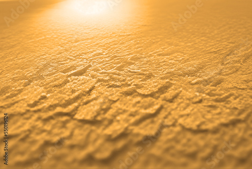 Gold yellow background texture, wavy silky black, golden and brownish shades of colors beautiful, hot and flowing design 