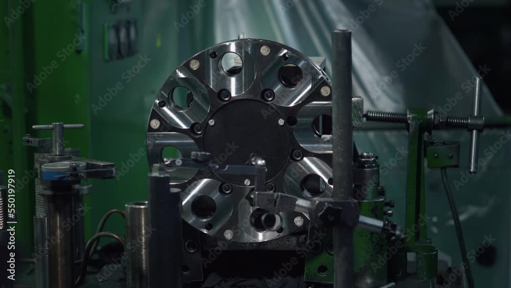 Machine for metalworking. The light changes in the frame. Manufacturing of industrial parts. CNC (digital control) are used to process metal products Machine for metalworking. The light changes in the frame. Manufacturing of industrial parts. CNC (digital control) are used to process metal products