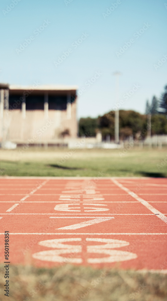 Empty stadium, sports and race track with numbers for start position in athletics, marathon or competition. Ground, arena and event field for running, sprint or cardio exercise, workout or training.
