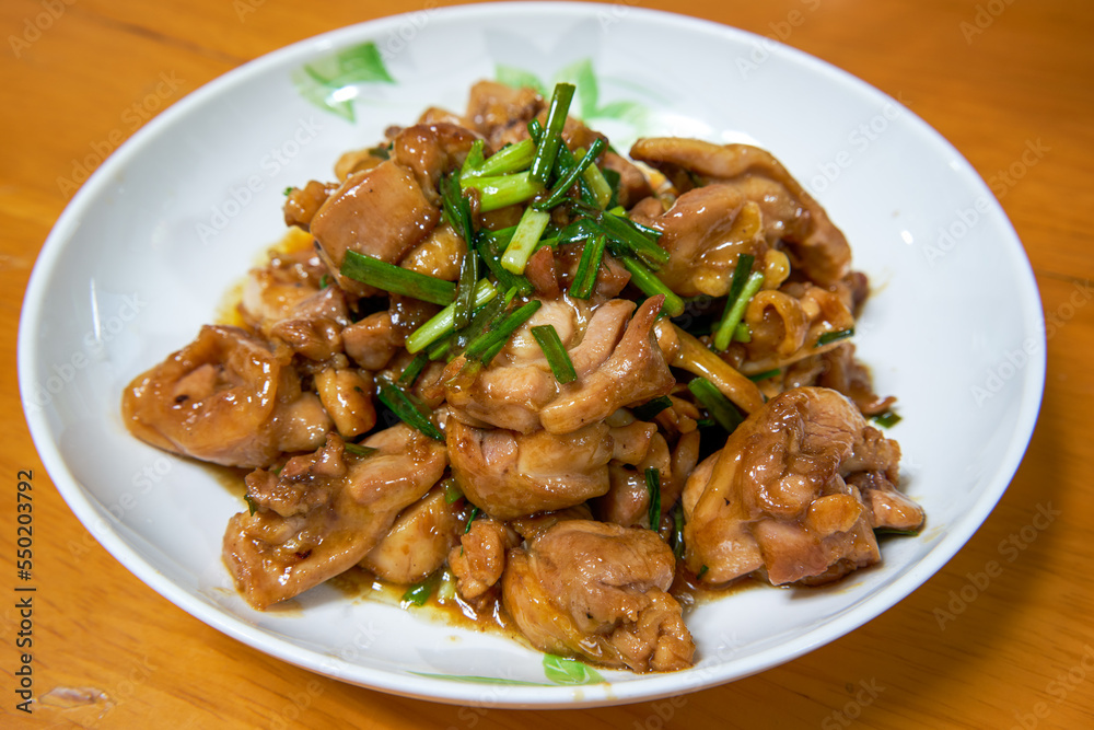 A delicious Chinese home-cooked dish, stir-fried chicken thigh with sauce