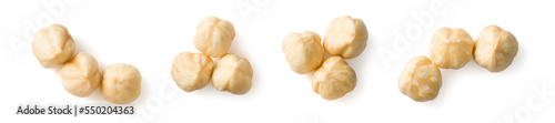 Peeled hazelnuts isolated on the white background, top view
