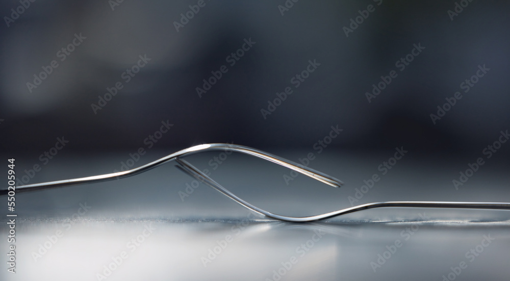 Silver, balance and fork in studio for catering or eating in a restaurant, house or home on a table with black background. Metal, teamwork and kitchen utensils showing partnership and collaboration Silver, balance and fork in studio for catering or eating in a restaurant, house or home on a table with black background. Metal, teamwork and kitchen utensils showing partnership and collaboration