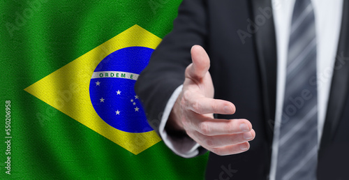 Welcome to the Brazil. Hand on Brazilian flag background. Business  politics  cooperation and travel concept