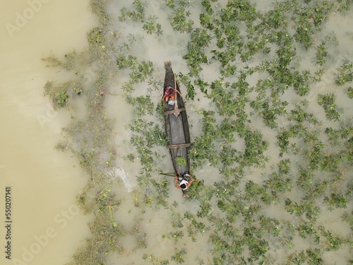 Aerial shot of flooded Area with ships and buildings in Taherpur Sunamganj, Bangladesh photo