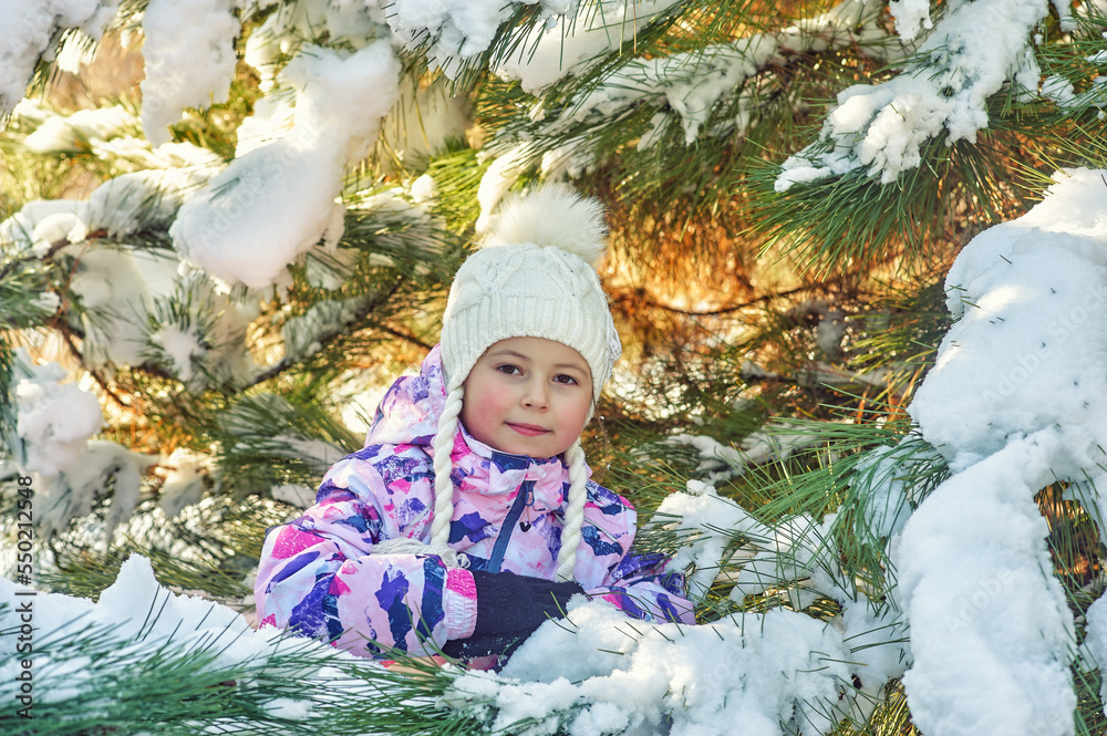Happy little girl on a winter walk