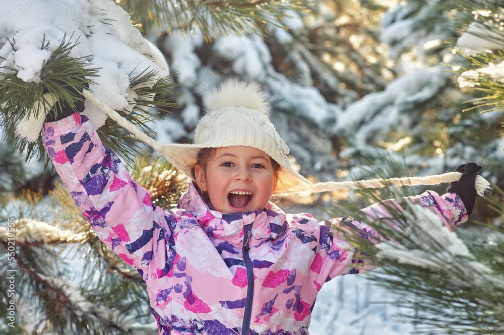 Happy little girl on a winter walk