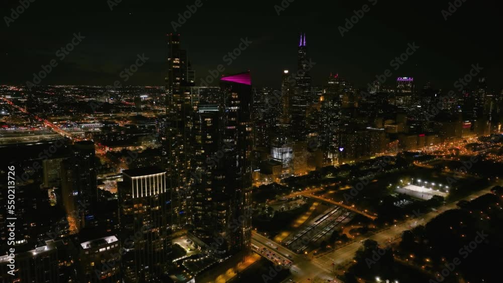 Aerial view of illuminated luxury condos and Grant park, night in Chicago, USA Aerial view of illuminated luxury condos and Grant park, night in Chicago, USA