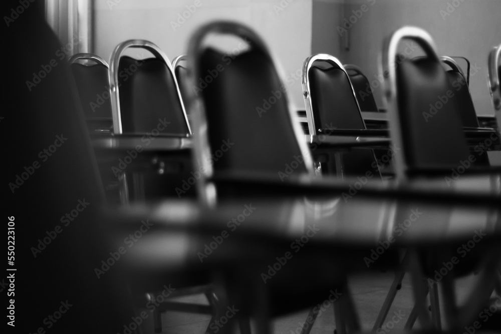 Lecture chairs in the room on black and white Lecture chairs in the room on black and white