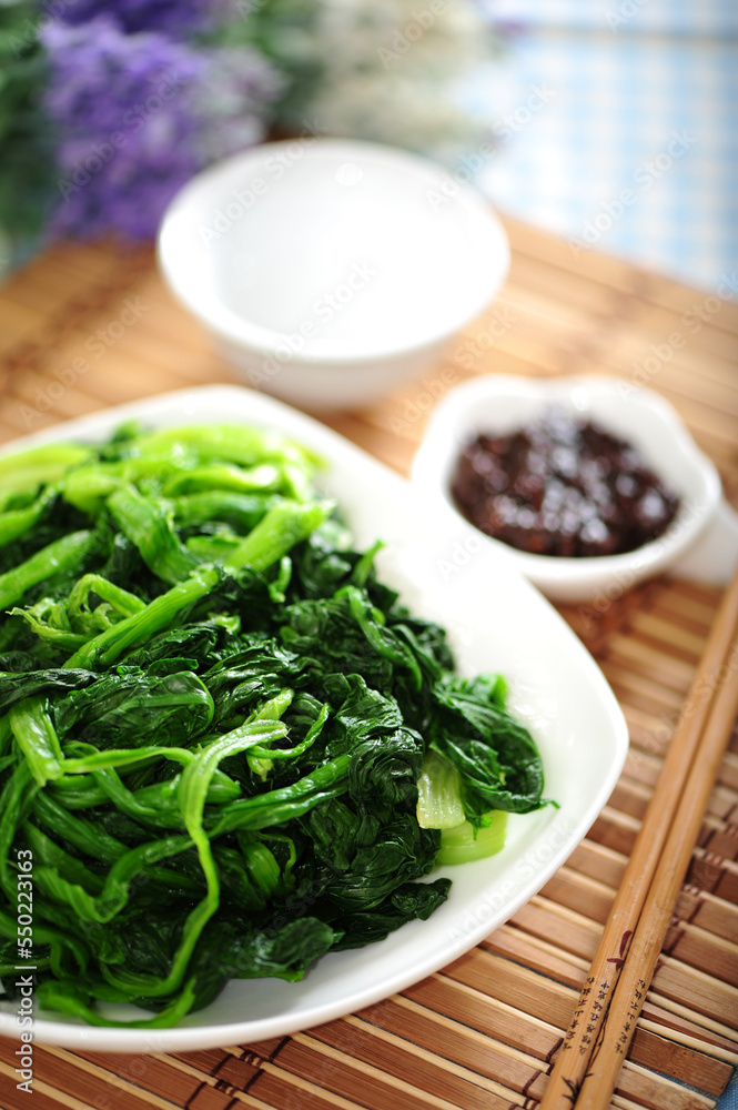 Boiled spinach on the white background Boiled spinach on the white background