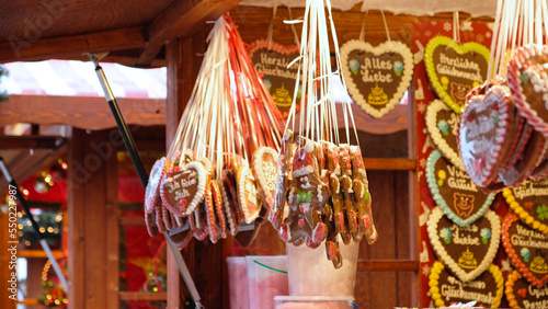 Traditional gingerbread cookies in the shape of hearts with the inscription - Ich liebe Dich - I love you - is sold at market in Weihnachtsmarkt in Germany, Europe. 