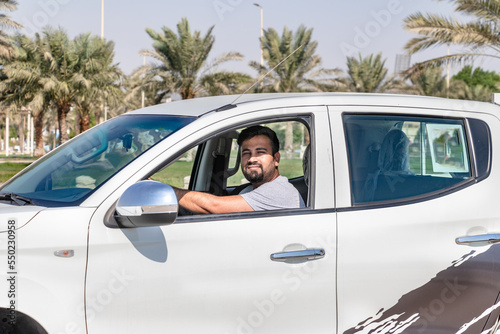 Man smiling in car