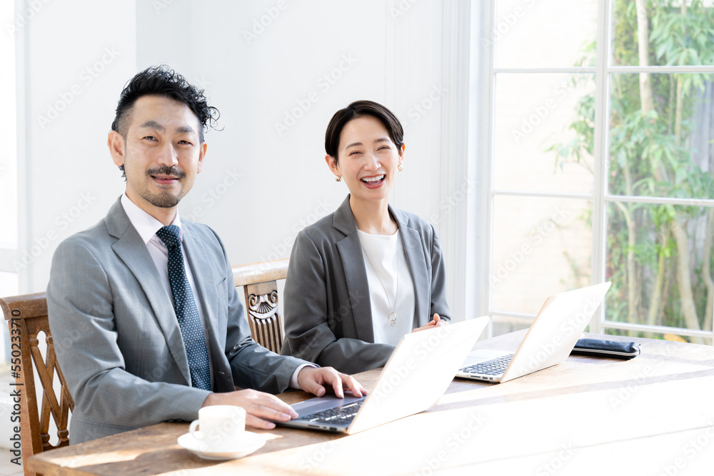 A team of Asian business people working together Looking at the camera A team of Asian business people working together Looking at the camera