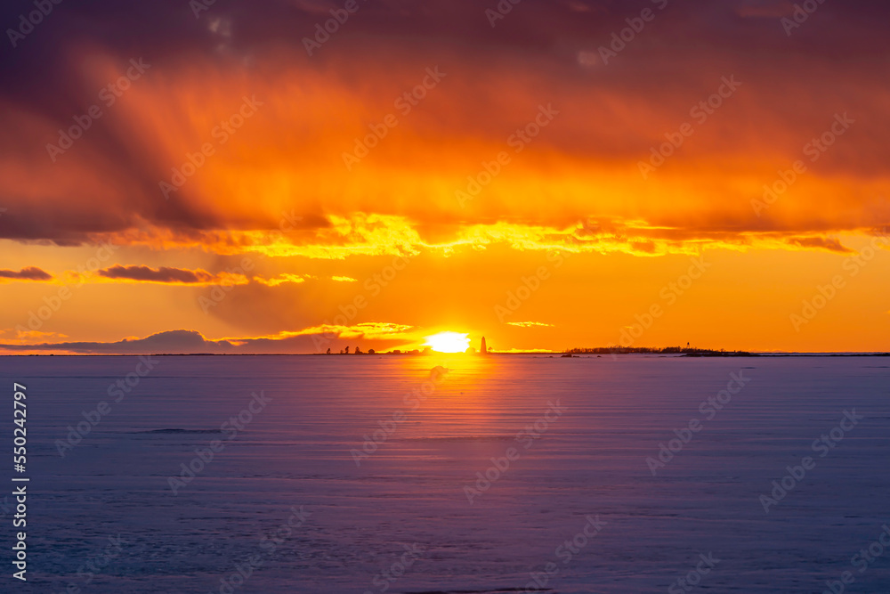 Dramatic winter sky at sunset. Pörkenäs, Finland
