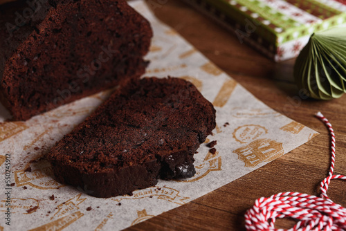 Homemade Chocolate Zucchini Cake with chocolate chips. Moist double chocolate cake with grated zucchini, cocoa powder, chocolate and chocolate chips. Healthy gluten free food. Selective focus