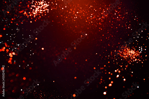 Red abstract bokeh on black background. Holiday concept