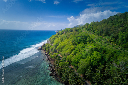 Drone View Over lush Coast of Praslin Island, Seychelles photo