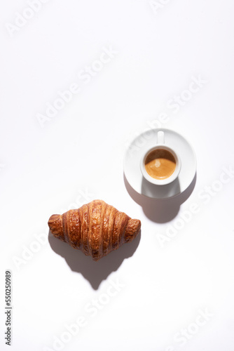 Croissants on white in a grid with hard light 