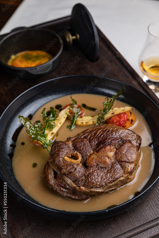 delicious fried steak in sauce in a restaurant
delicious fried steak in sauce in a restaurant