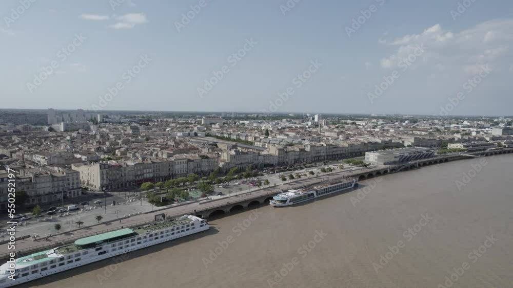 Two Cruises stationed in the Garonne River wharfs at Chartrons neighborhood of Bordeaux France, Aerial dolly in shot Two Cruises stationed in the Garonne River wharfs at Chartrons neighborhood of Bordeaux France, Aerial dolly in shot
