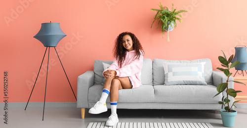 Young woman relaxing on com...