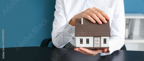 Real estate agent with hous...
