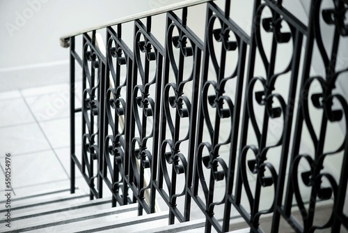 Принти на полотні Closeup of the stairs with decorative metal handrails.