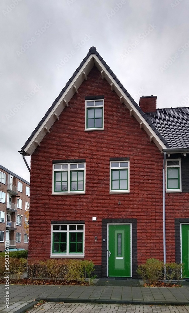 Red brick house with green door