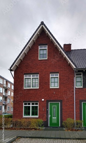 Red brick house with green door