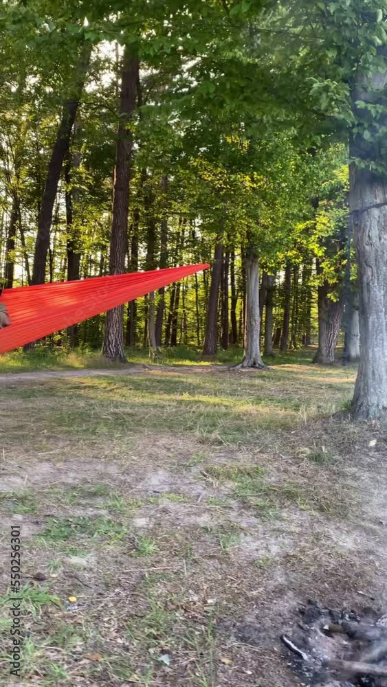 camping site woman in hammock summertime camping site woman in hammock summertime
