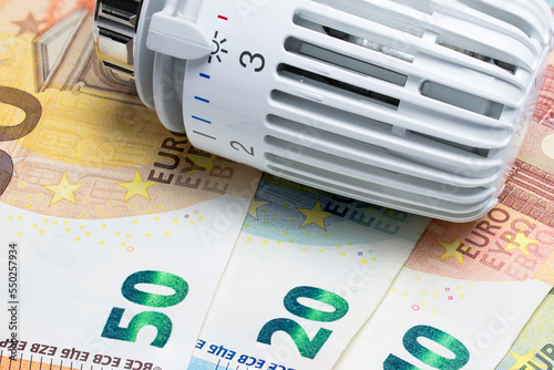 Heating thermostat on euro money banknotes. Temperature regulator. photo