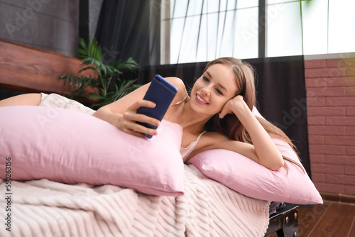 Pretty young woman using mo...