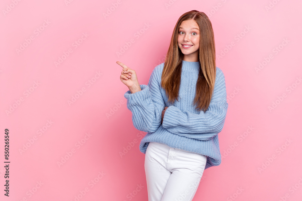 Photo of adorable nice lady dressed stylish cozy pullover arm direct empty space recommend boutique isolated on pink color background Photo of adorable nice lady dressed stylish cozy pullover arm direct empty space recommend boutique isolated on pink color background