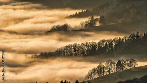 Photographie Fgg And Clouds In Hilly Landscape