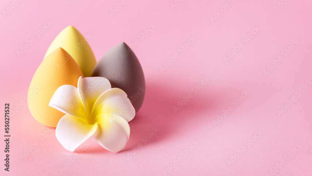 Yellow and Gray Make Up Egg Sponges Beauty Blenders Pink Background Copy Space Flower