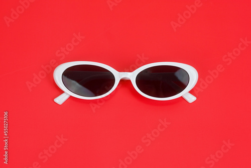 white cat eyes sun glasses ,chic fashion beauty glasses, woman fashion colorful background,