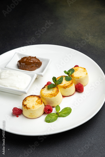 delicious cheesecakes with sour cream in a restaurant 