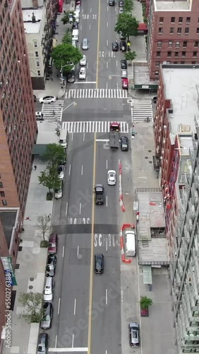 aerial view of drone over the streets of midtown new york. cars driving on the street, vertical video for smart phone