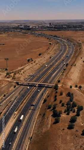 drone aerial view of a freeway with cars , Vertical video for smart phone