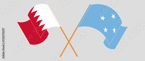 Crossed and waving flags of Bahrain and Micronesia