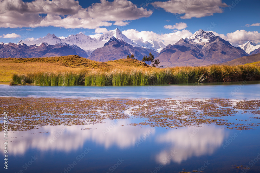 Wilcacocha lake reflection in Cordillera Blanca, snowcapped Andes, Ancash, Peru