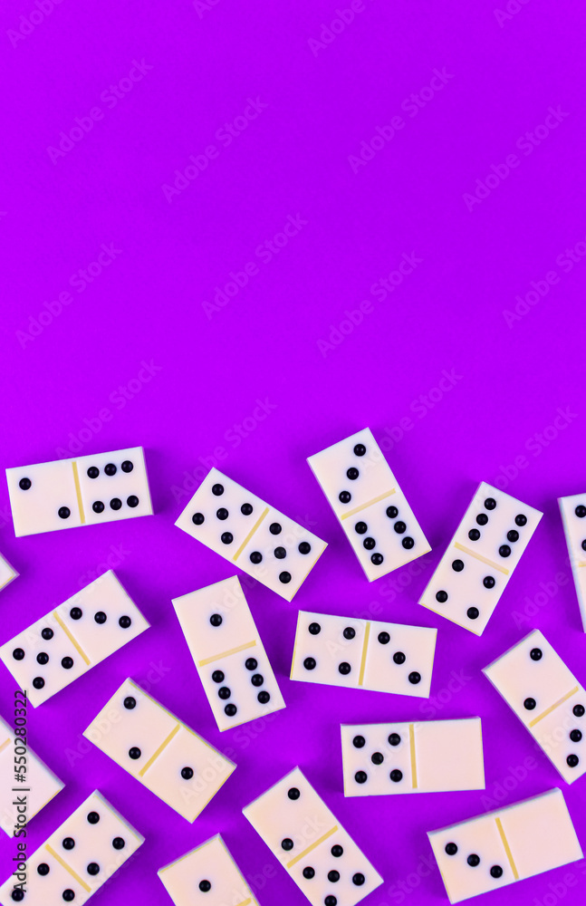 White dominoes on a purple background White dominoes on a purple background