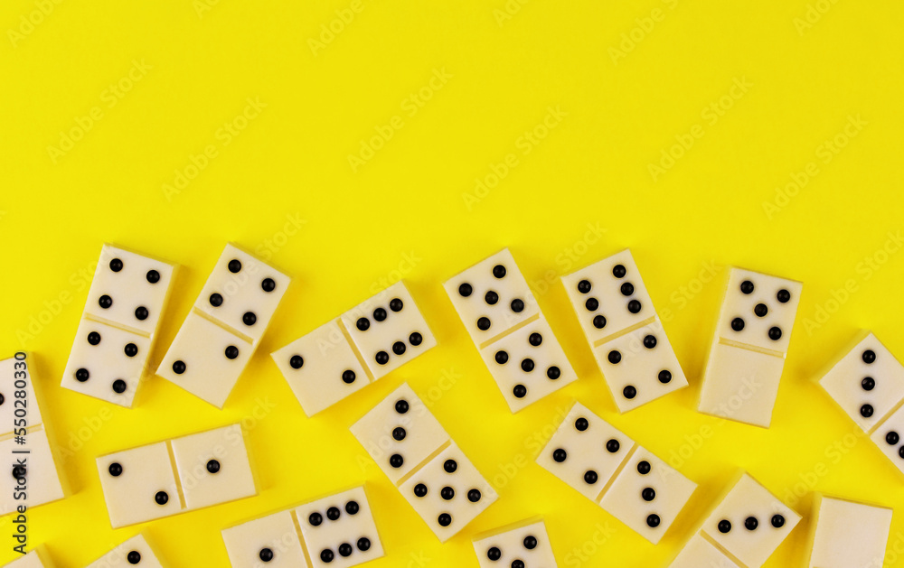 White dominoes on a yellow background White dominoes on a yellow background
