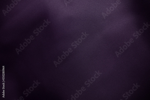 Dark purple fabric texture shiny luxury background.